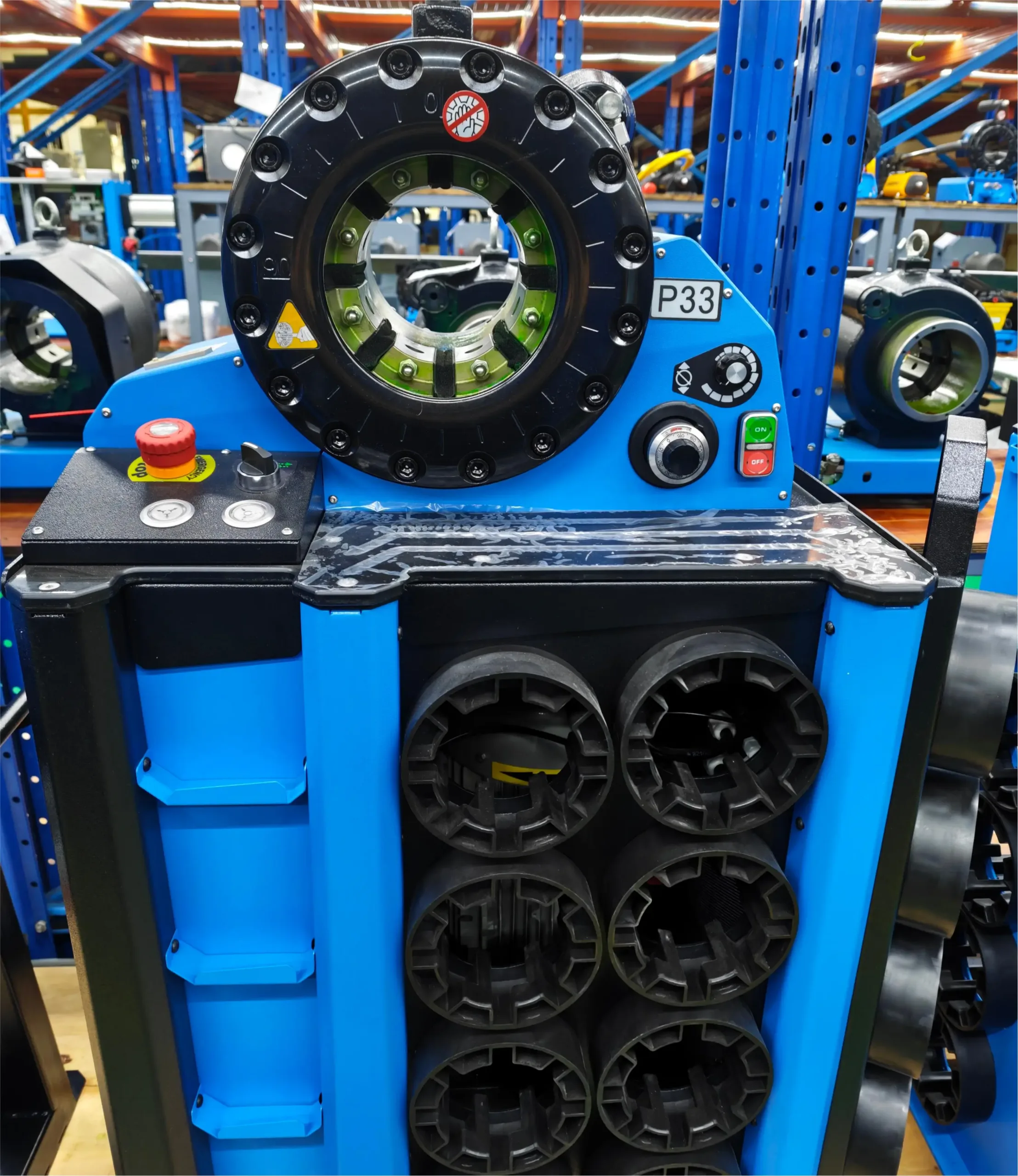 P33 hydraulic hose crimper with segmented dies stored by machine